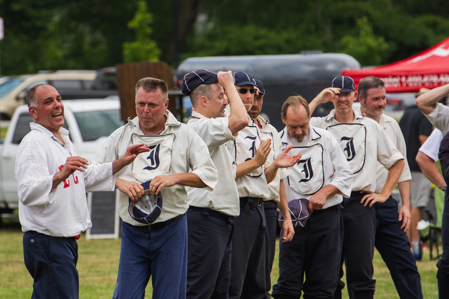 Members of the Elkhart County Railroaders and the Indianapolis Blues address the crowd after a game on Saturday.